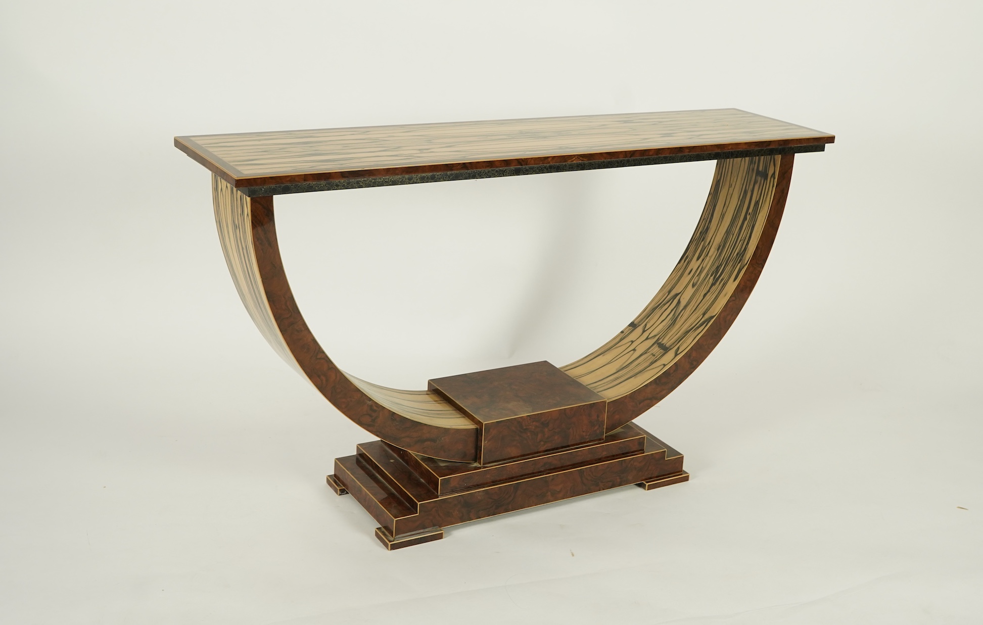 An Art Deco style white ebony and walnut console table